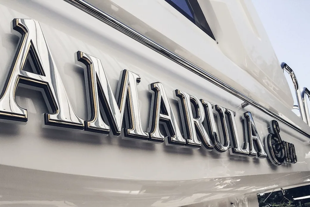 Backlit stainless yacht name — regular rinse cycles protect finish longevity.