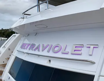 Single-color illuminated yacht sign — warm white aesthetic for transoms.