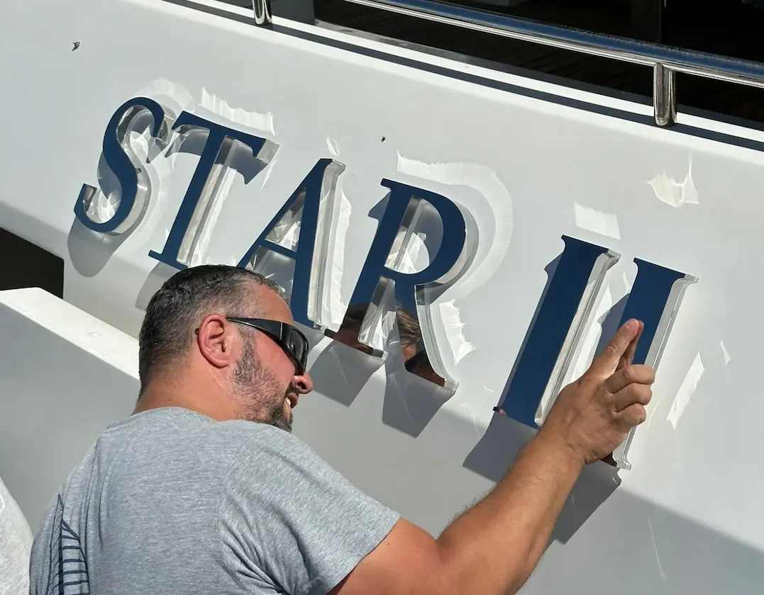 Mirror stainless illuminated yacht sign — maximum reflection on dark hulls.