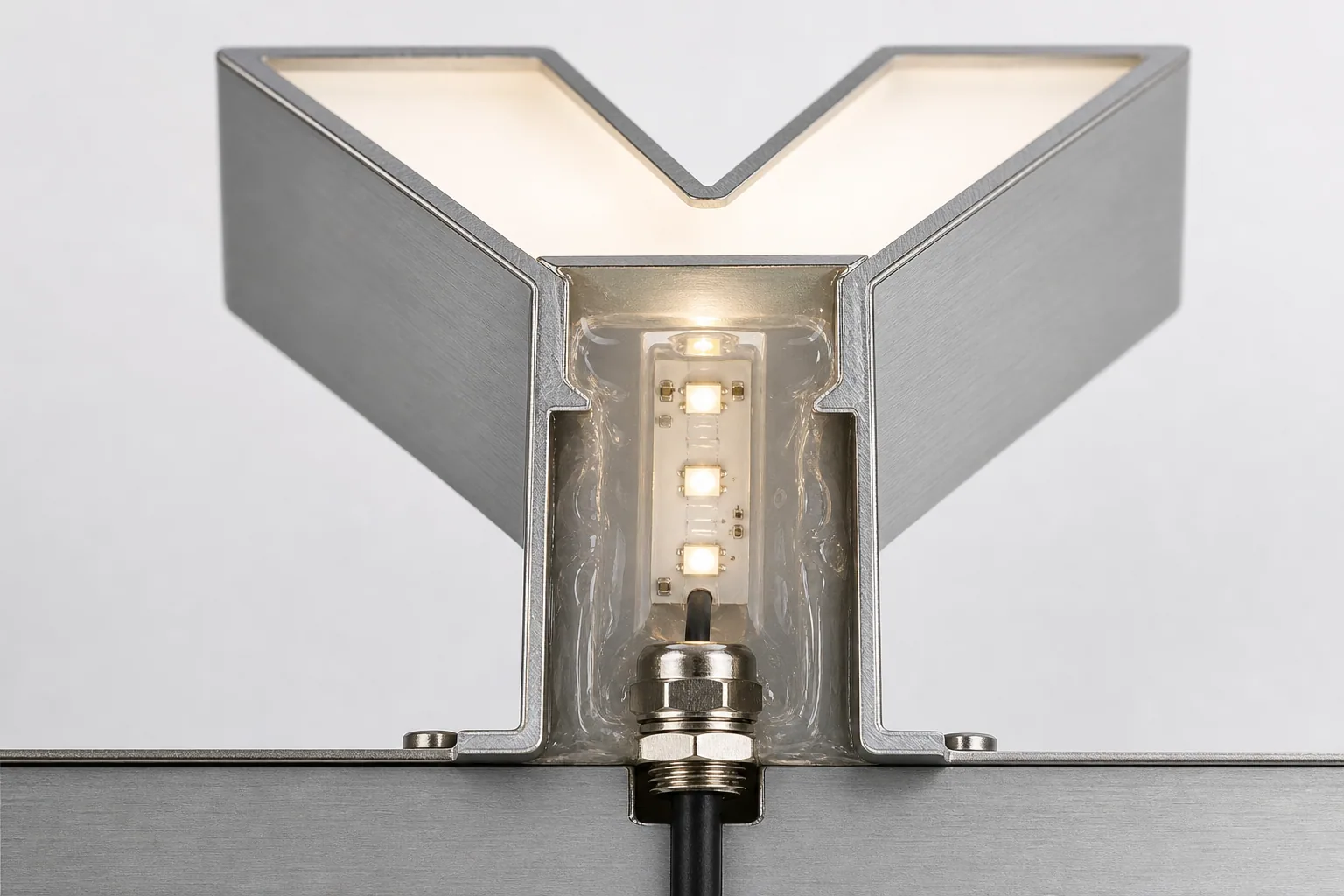Cross-section of potted marine-grade LED module inside stainless yacht letter channel.